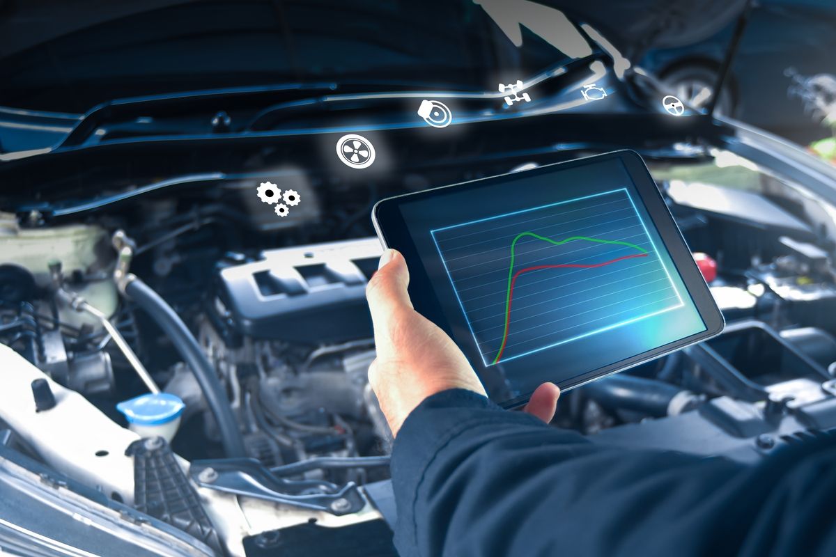 Technician performing OBD-II emissions test